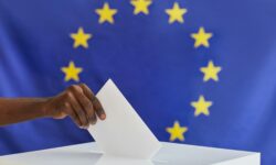 Man voting in voting booth