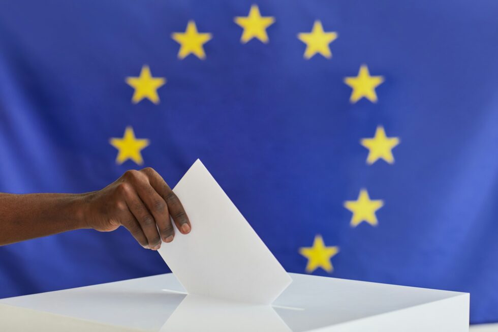 Man voting in voting booth